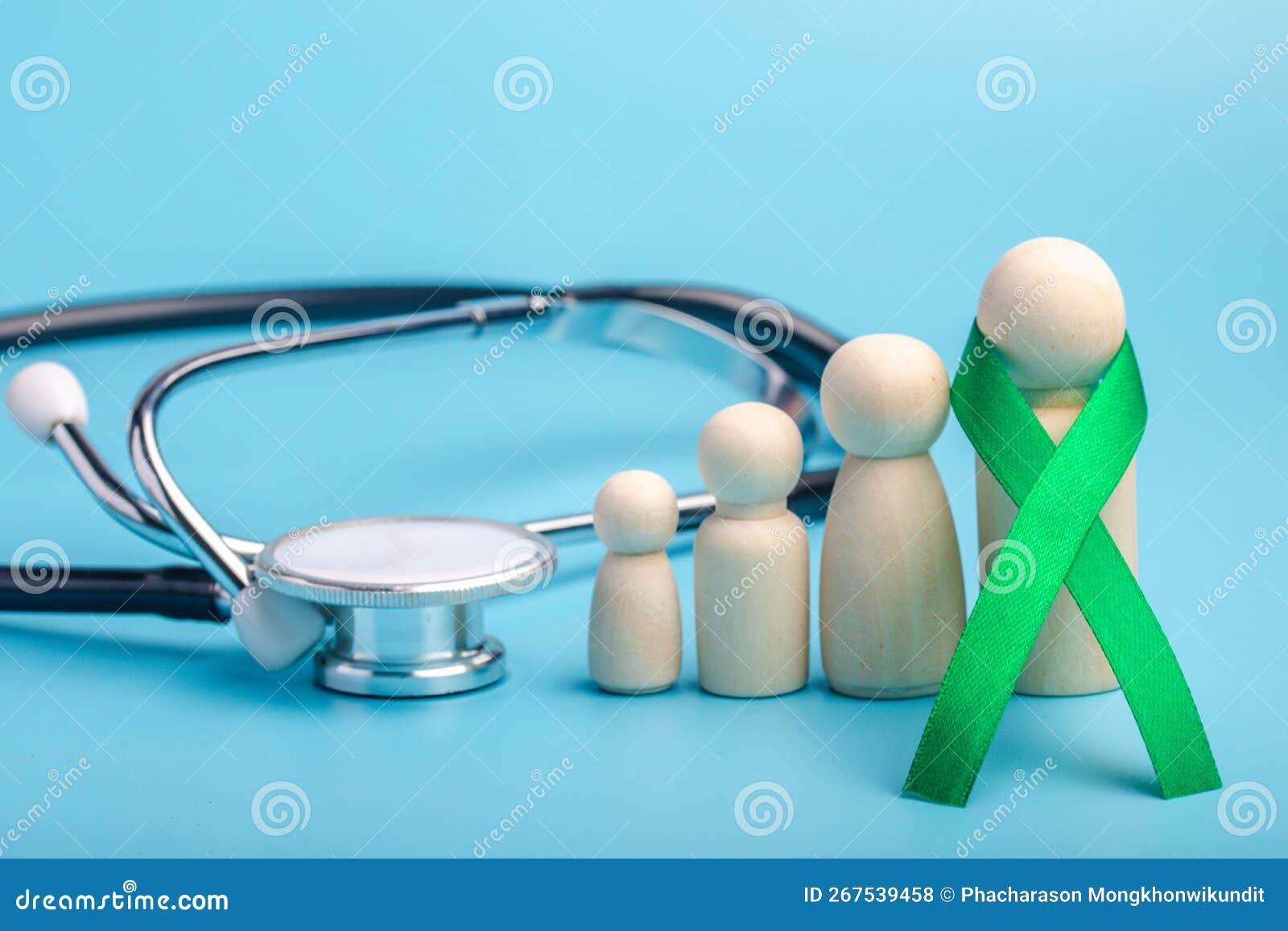 green ribbon and stethoscope.treatment concept for ovarian cancer and cervical cancer