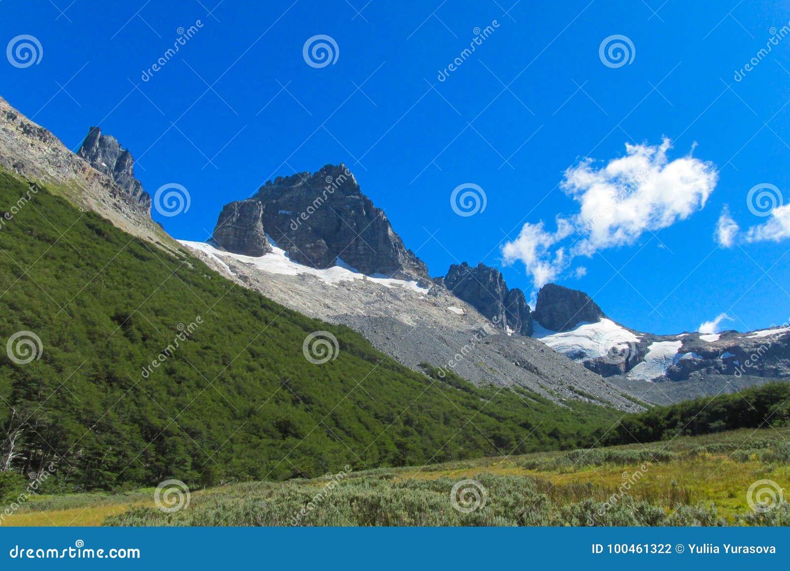 Green and rocky mountain stock photo. Image of majestic 100461322