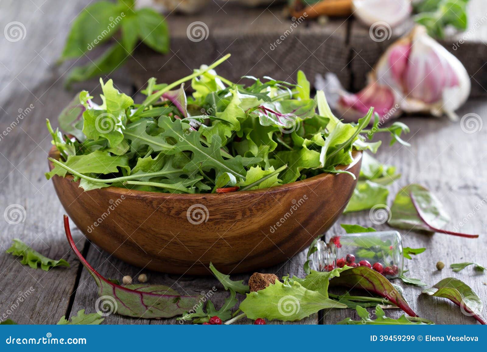 green salad leaves in a wooden bowl