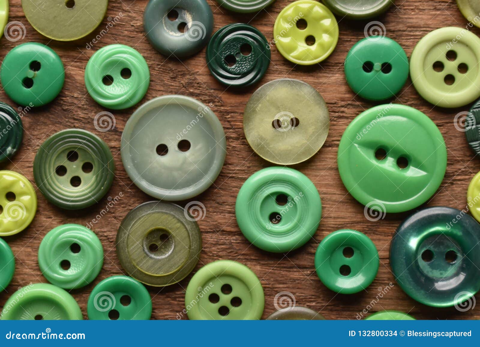 Green Sewing Buttens on Wood from Above Stock Photo - Image of wood ...