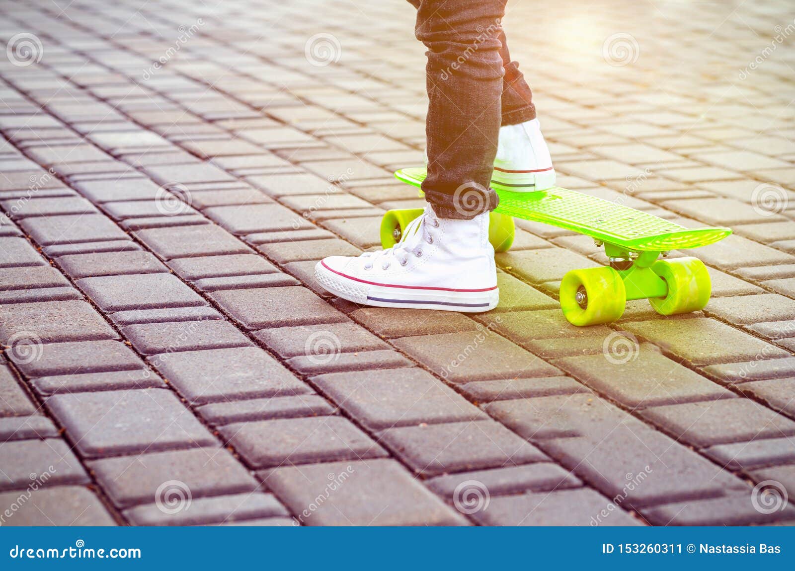 Green Skateboard and Kids Sneakers. Outdoors Stock Image Image of summer, sneakers 153260311