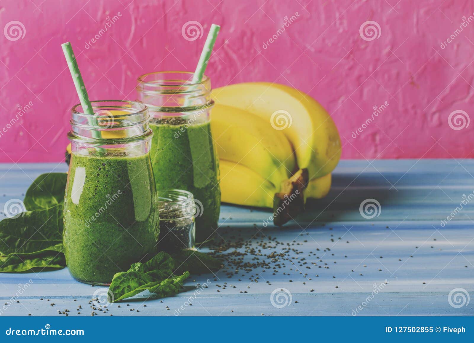 Green Smoothies in Glass Bottles on Cool Pink Blue Background Wi Stock ...