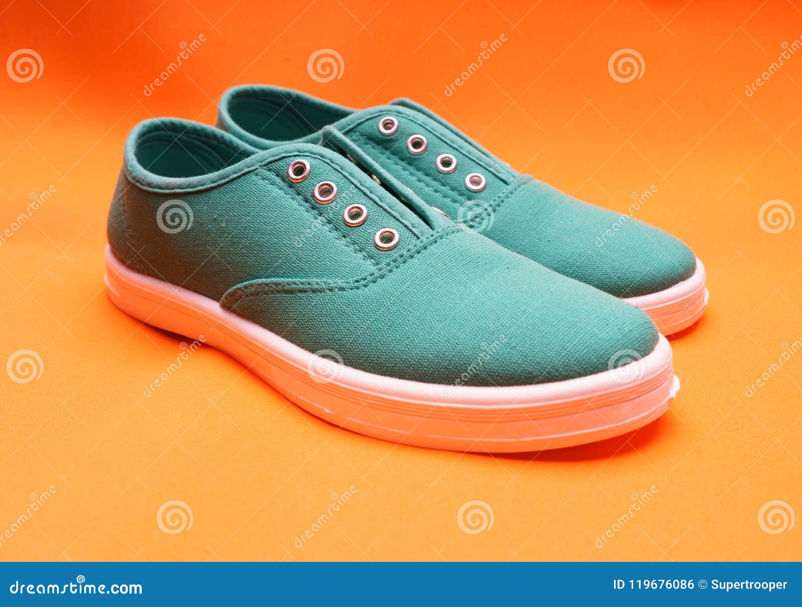 Green Sneakers on Orange stock photo. Image of pastel - 119676086