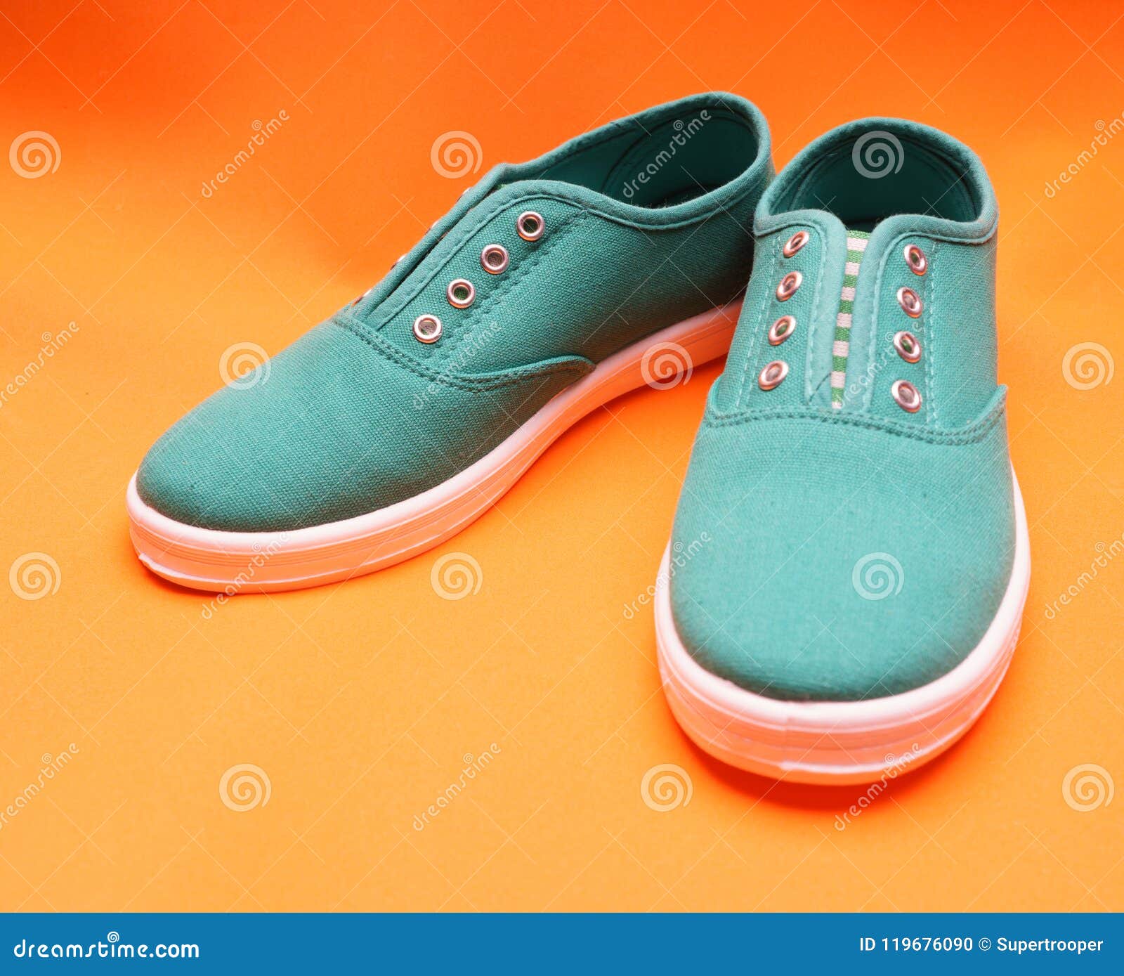 Green Sneakers on Orange stock photo. Image of football - 119676090