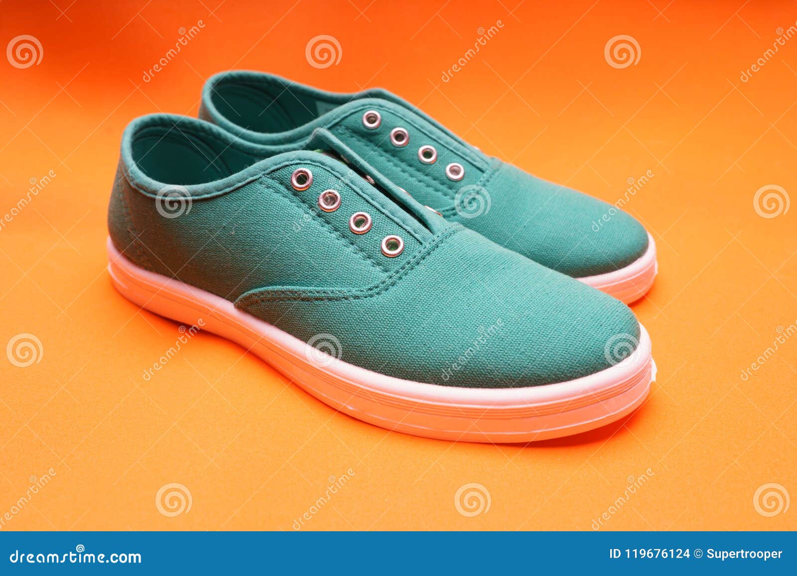 Green Sneakers on Orange stock photo. Image of shoes - 119676124