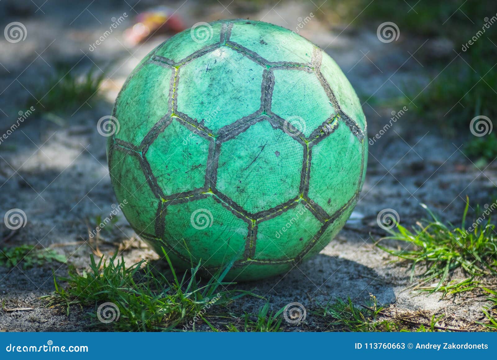 Green Soccer Ball Lies on the Ground. Stock Image Image of lowangle