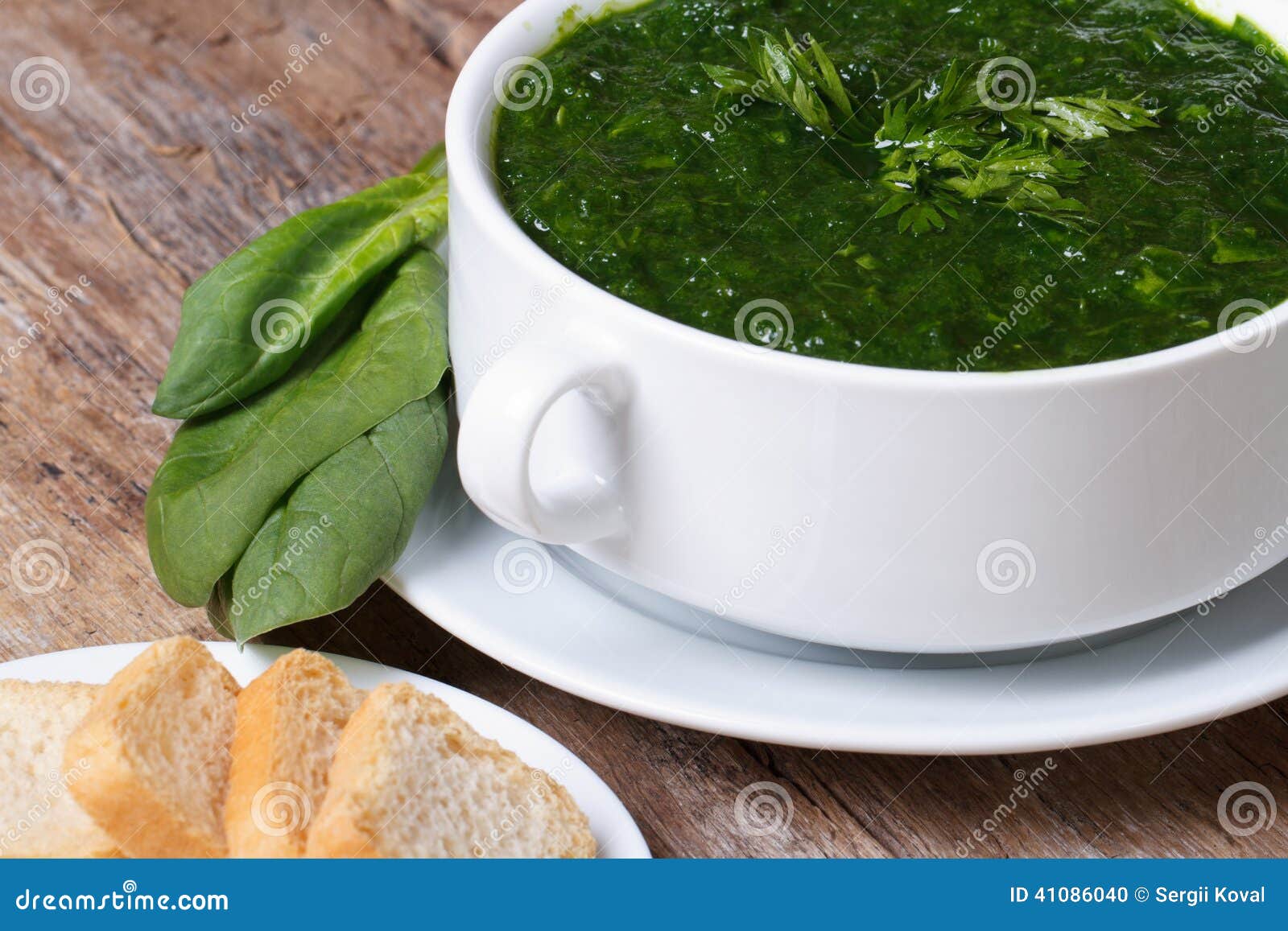 Green Spinach Soup with Croutons Close Up. Horizontal Stock Photo