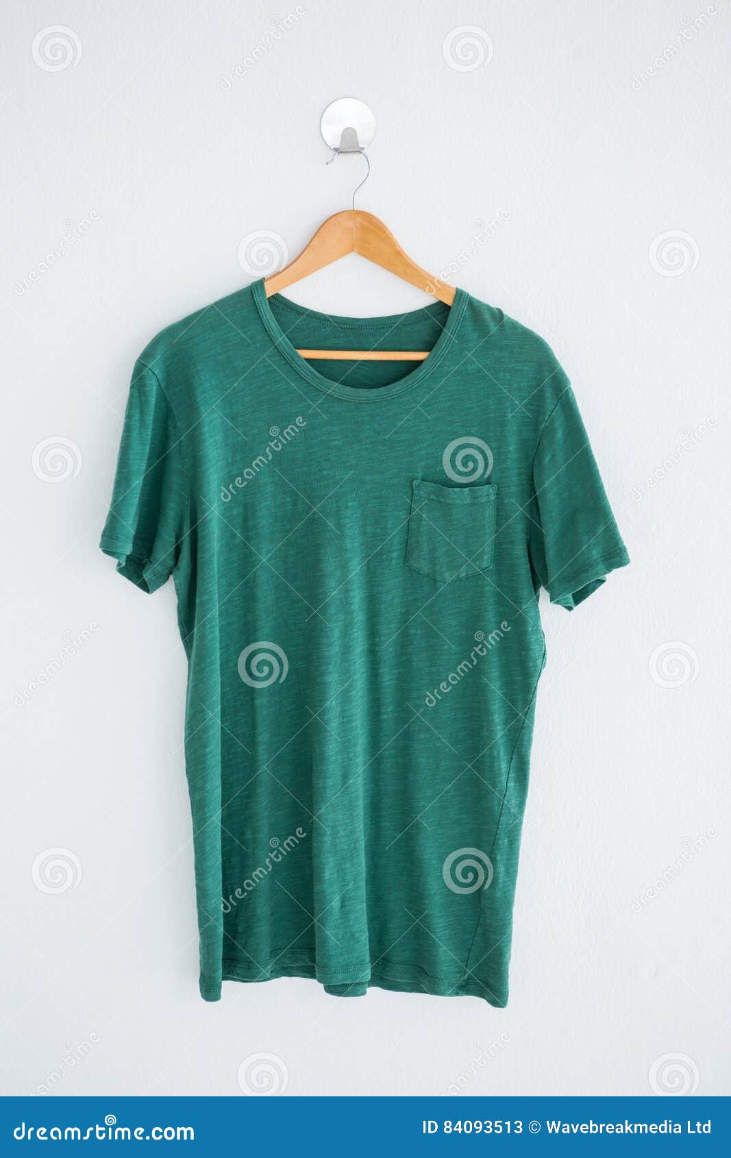 Green t-shirt on hanger stock image. Image of white, clothing - 84093513