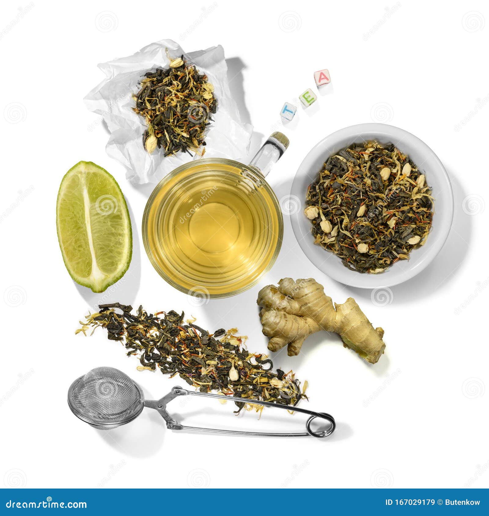 Green Tea with Aromatic Additives and Accessories. Top View on White