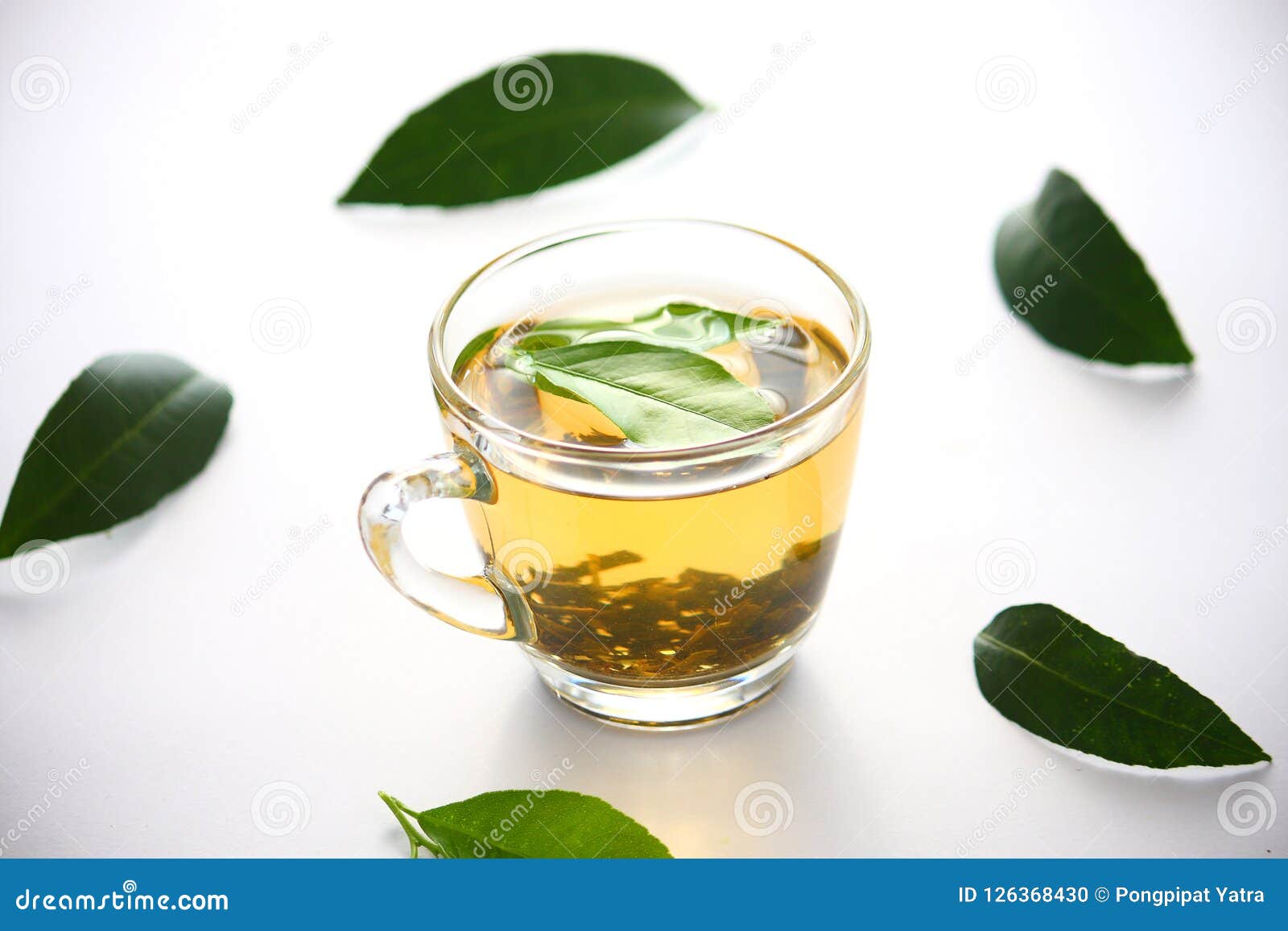 A Glass of Tea Leaves Green on a White Background. Stock Photo - Image ...