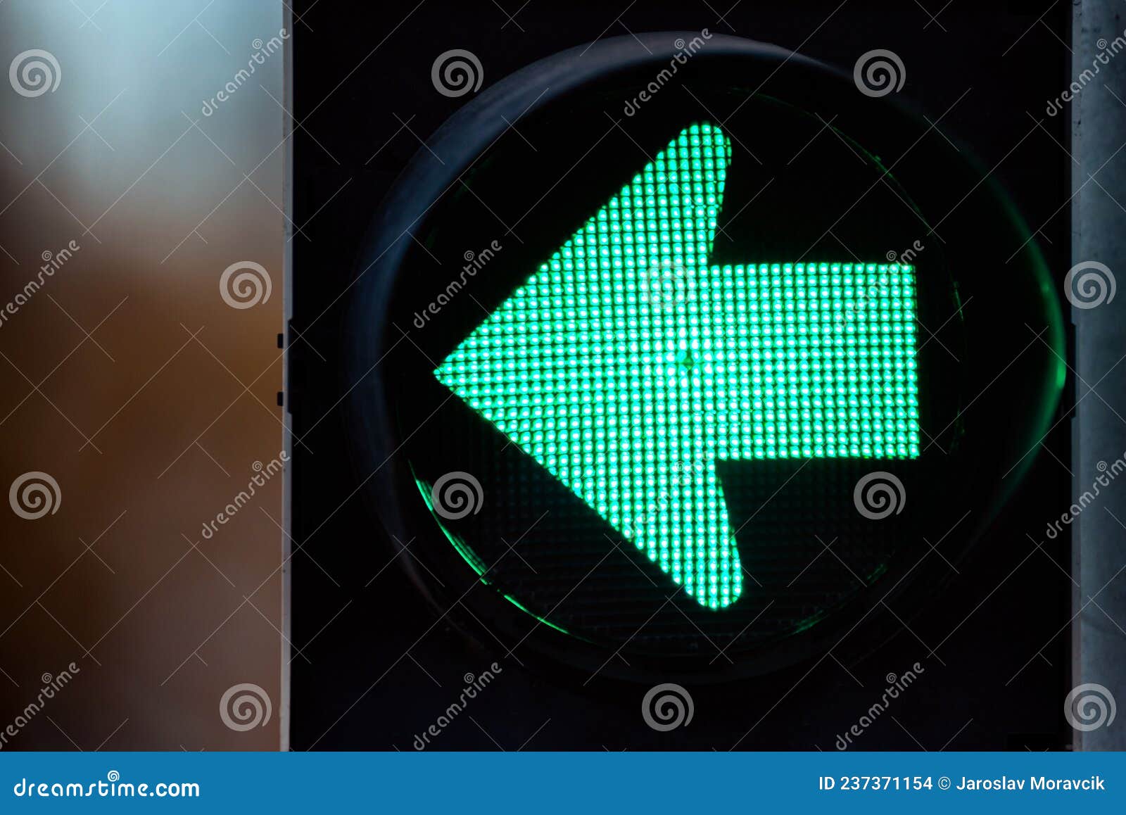 Green Traffic Light with Green Arrow Light Up. Turn Left Stock Photo