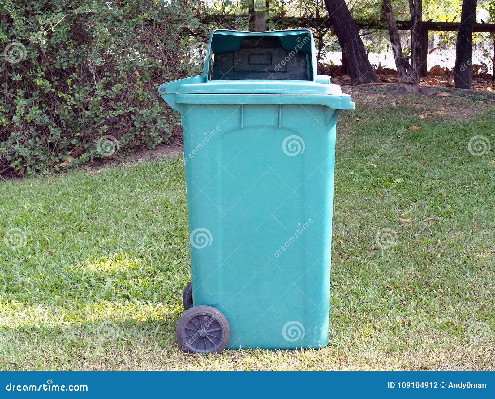 Green Trash Can (garbage Bin) on Green Grass Lawn in Public Park Stock Photo Image of