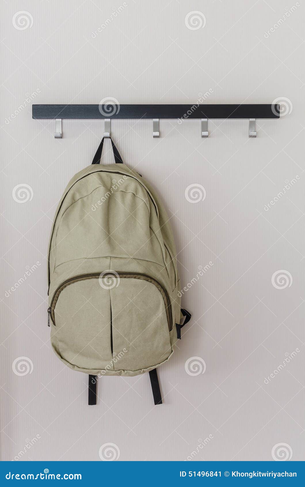 Green Travel Backpack Hanging on the Wall Stock Image - Image of