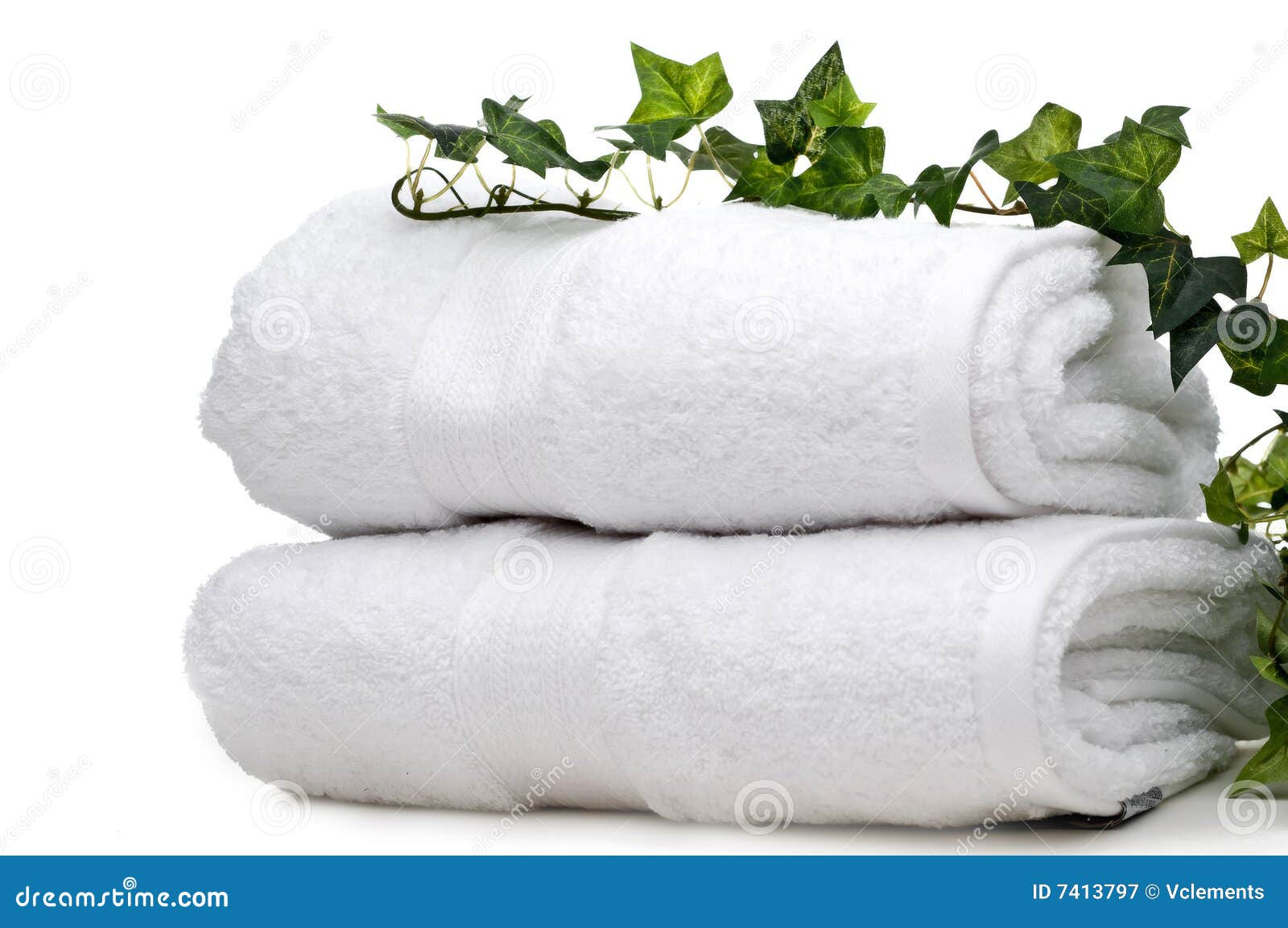 Green vine on white towels stock image. Image of comfortable 7413797