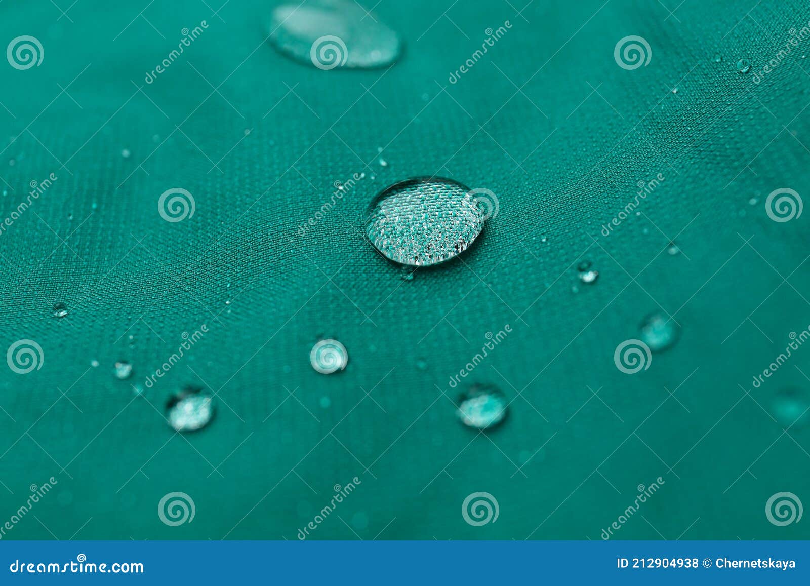 Green Waterproof Fabric with Water Drops As Background, Closeup Stock