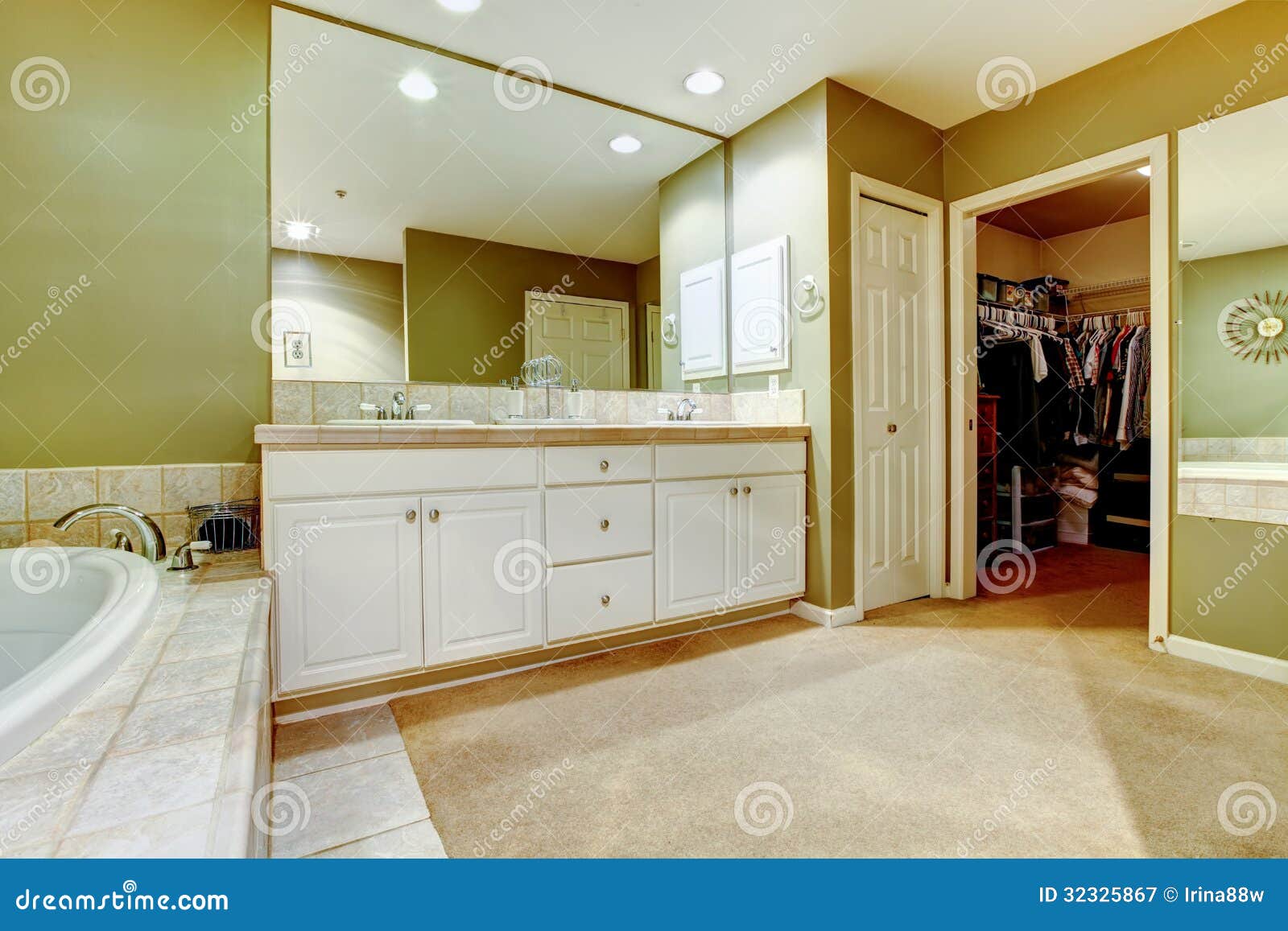 Green And White Bathroom With Two Sinks And Closet 