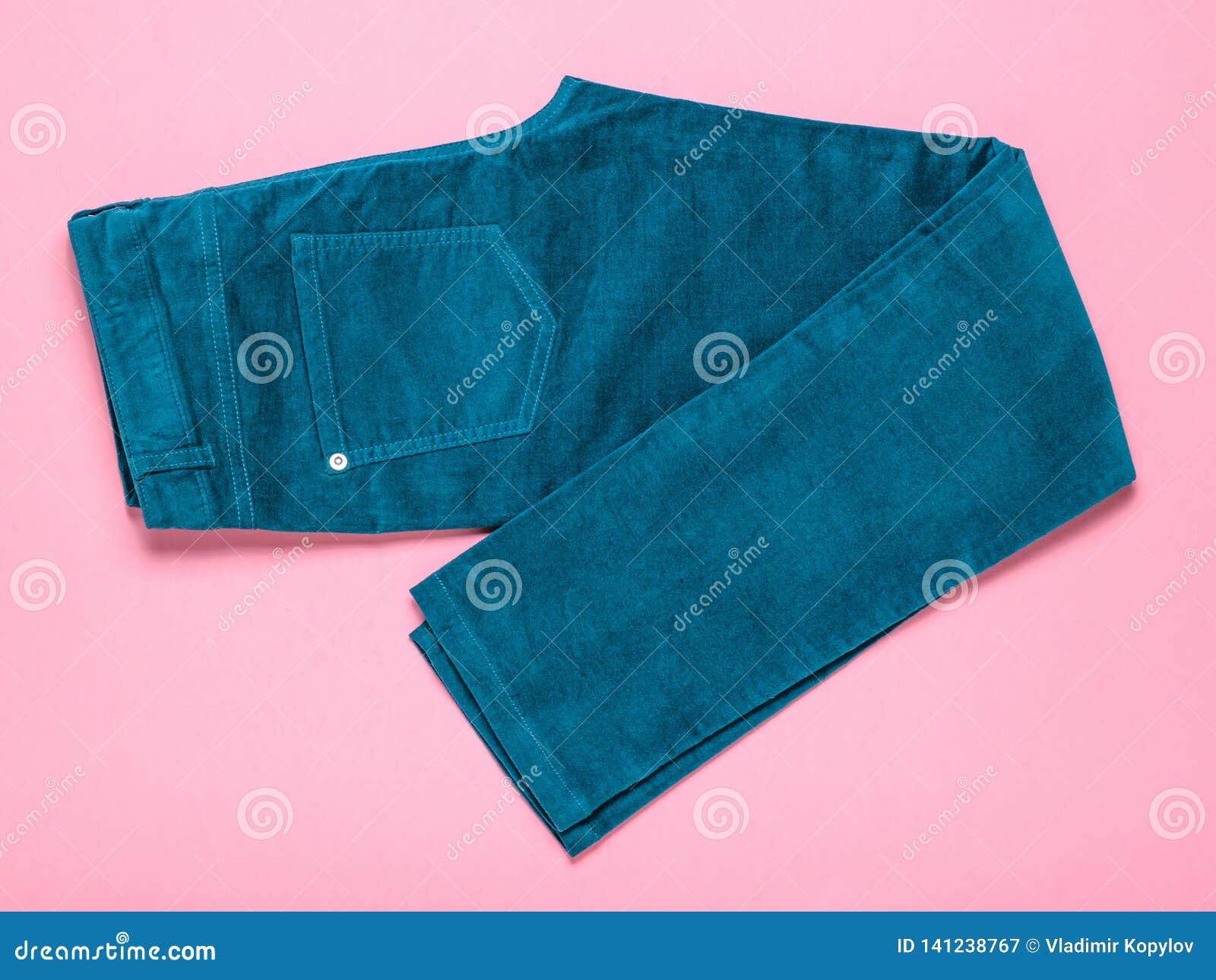 Green Women`s Jeans Beautifully Stacked on a Pink Background Stock ...