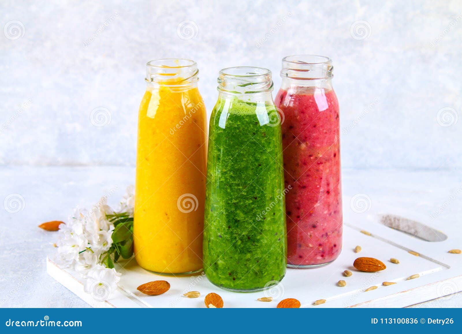 Download Green Yellow Purple Smoothies In Bottles Of Berries Greens O Stock Photo Image Of Fruit Glass 113100836 Yellowimages Mockups