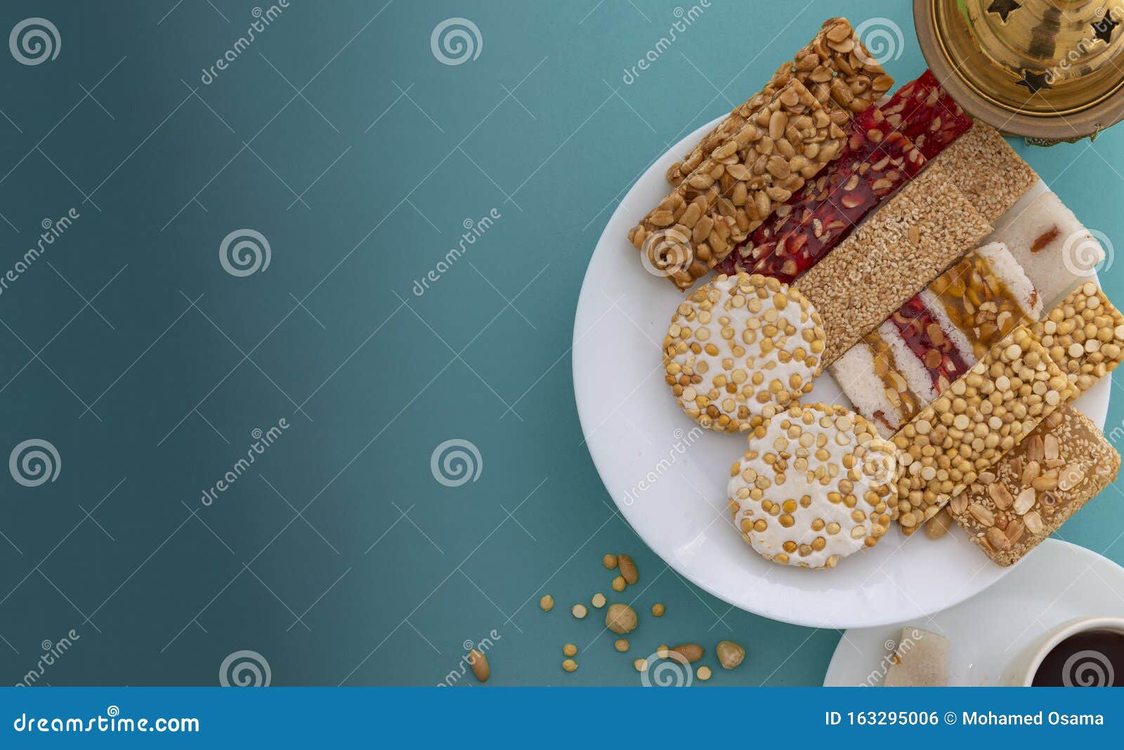 greeting card of traditional mawlid dessert on blue