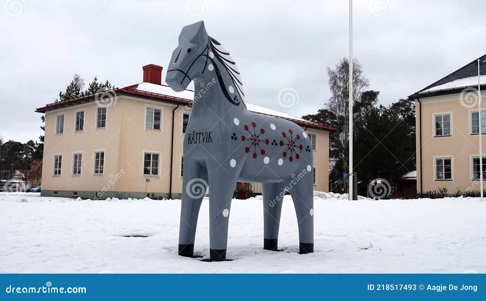 grey dalarna horse in front of rattvik townhall in winter in sweden
