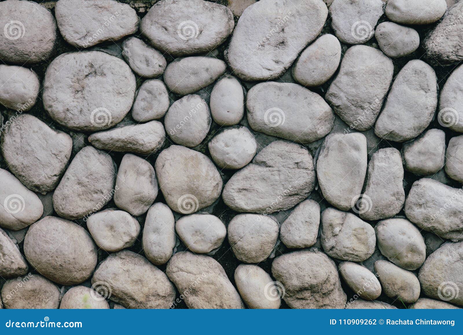 Grey or Gray Stone Wall with Natural Texture Round Stone photo