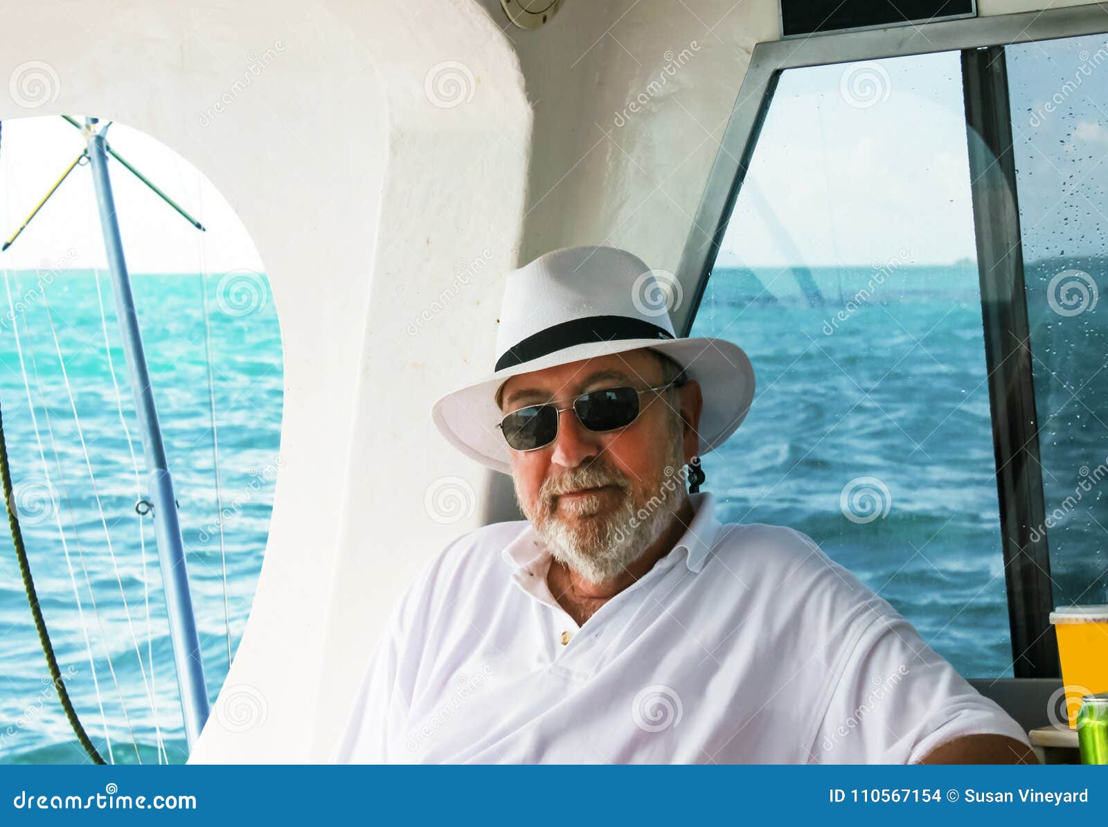 https://thumbs.dreamstime.com/z/grey-haired-bearded-man-hat-relaxing-deep-sea-fishing-boat-ocean-background-110567154.jpg