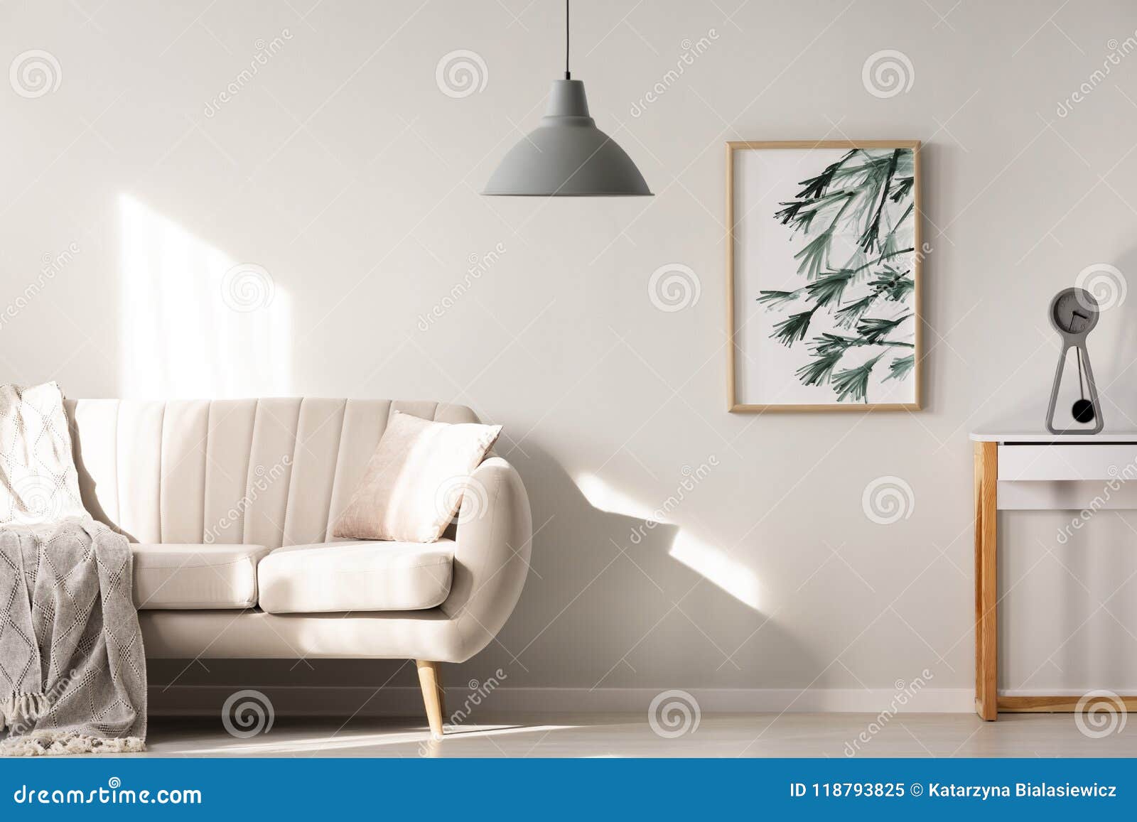 grey lamp in bright living room interior with poster next to bei