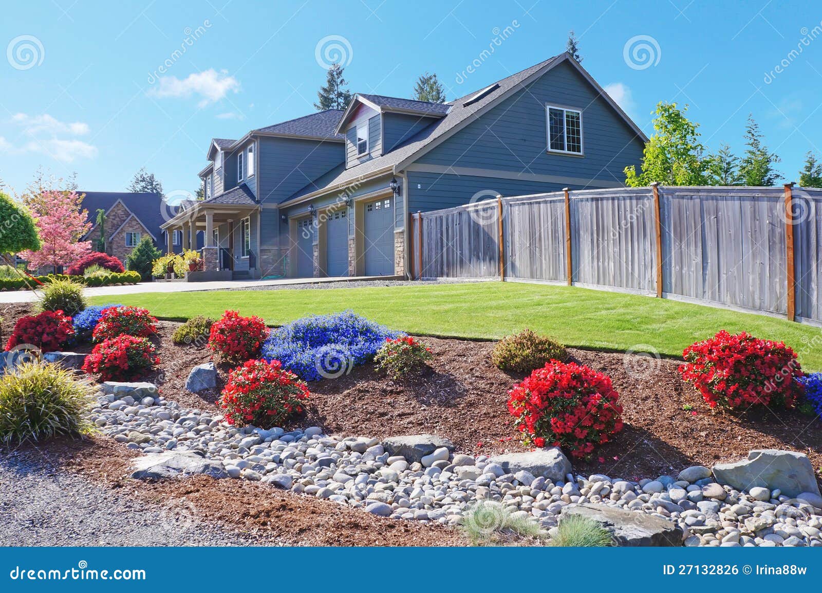 Grey Large Luxury House with Spring Flowers. Stock Photo Image of