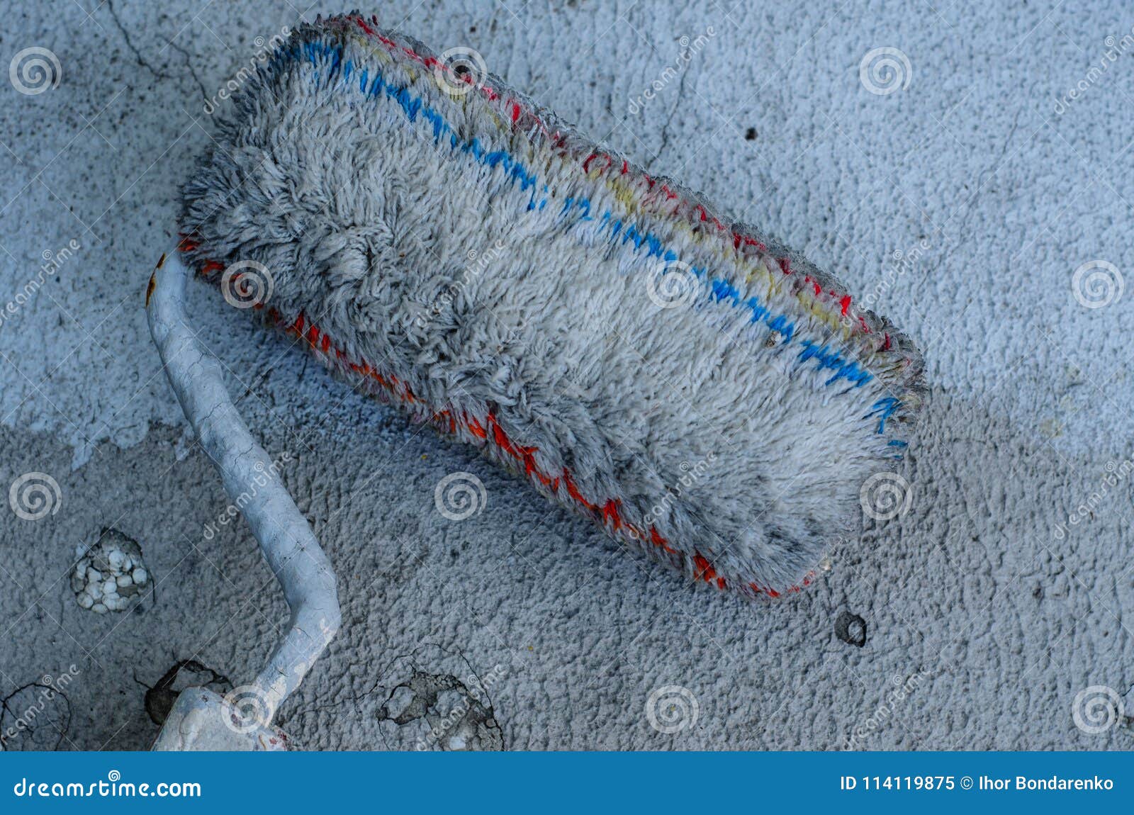 Grey Paint Roller on a Cracked Decorative Stucco Stock Image Image of