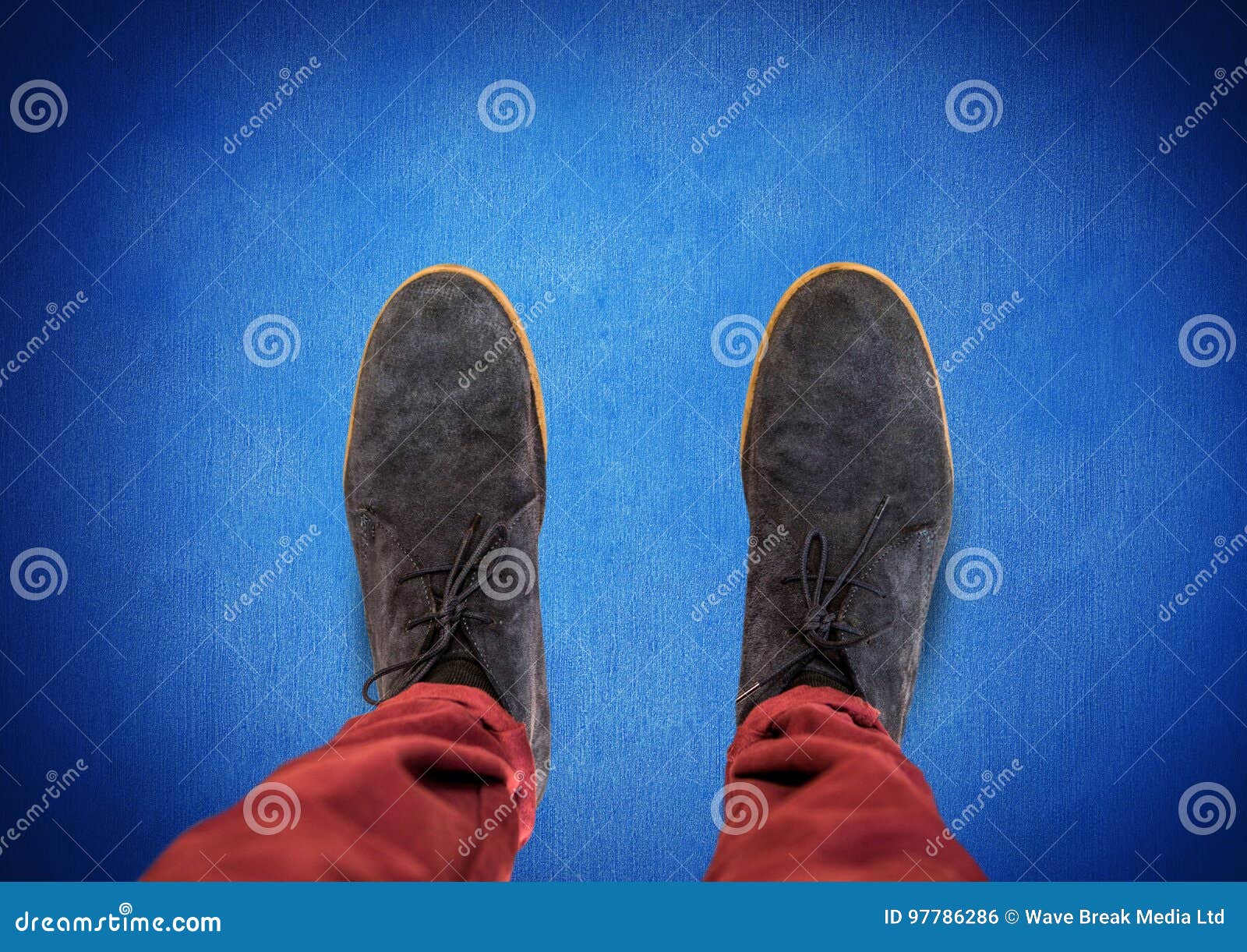 Grey Shoes on Feet with Blue Background Stock Photo Image of shadow