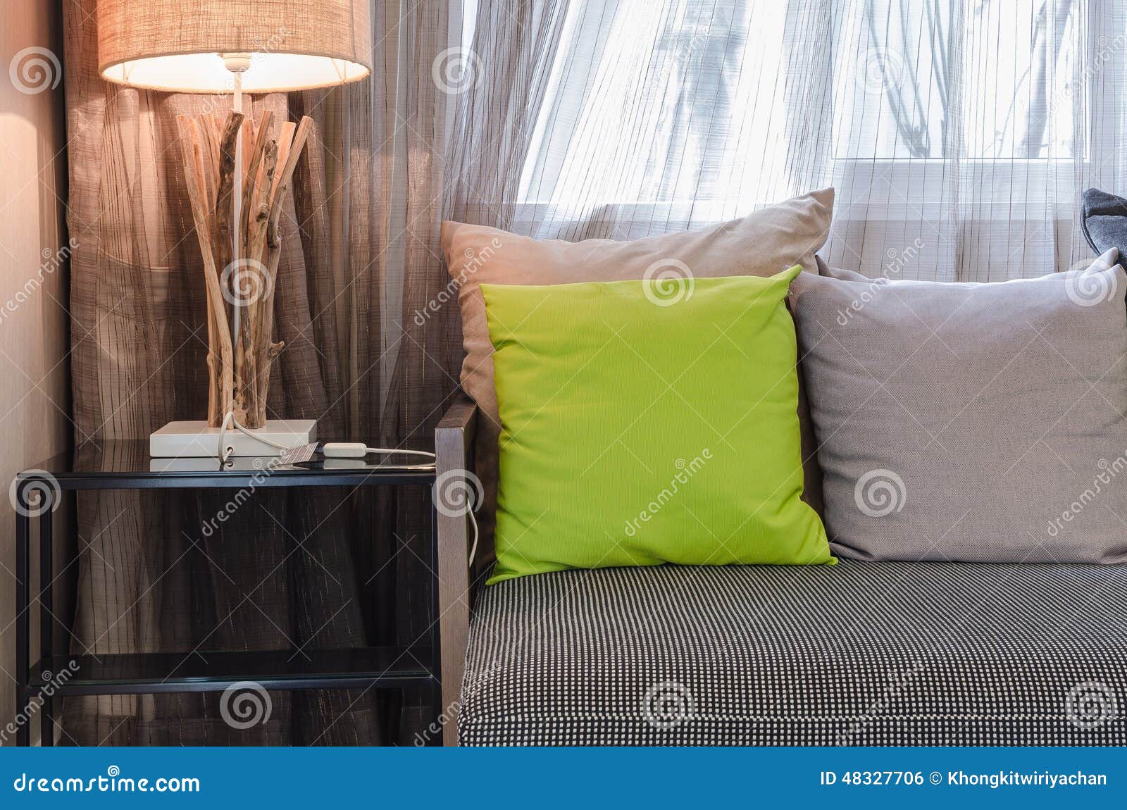 Grey Sofa with Green Pillow in Living Room at Home Stock Photo Image