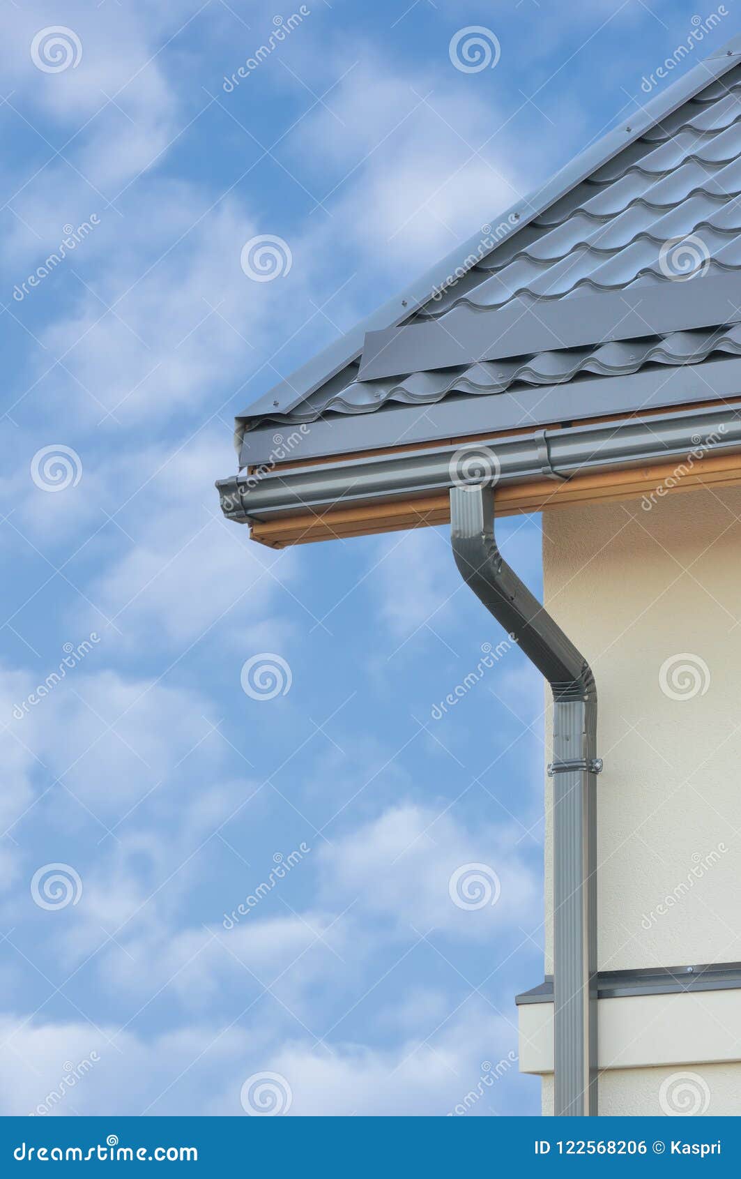 grey steel tile roof texture background, gray tiled roofing, beige yellow plastered wall, rain gutter, large detailed vertical