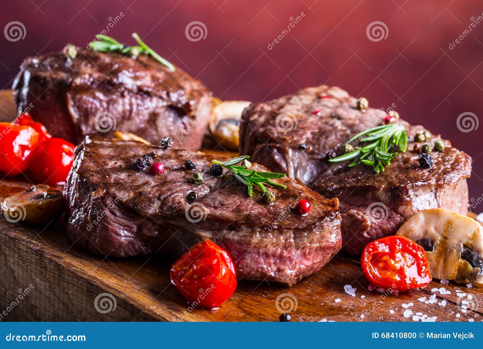 grill beef steak. portions thick beef juicy sirloin steaks on grill teflon pan or old wooden board