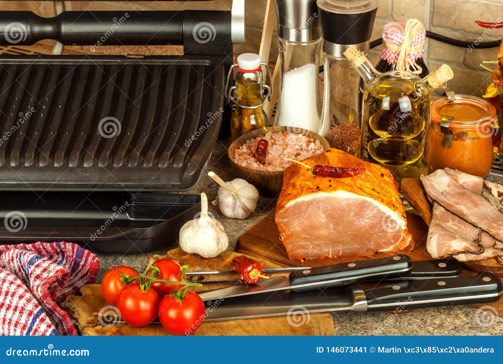 Grill steak on an electric stove. Pork neck fried on small electric grill.  Home cooking. Healthy barbecue. Catering to friends. Electric grilling.  Stock Photo