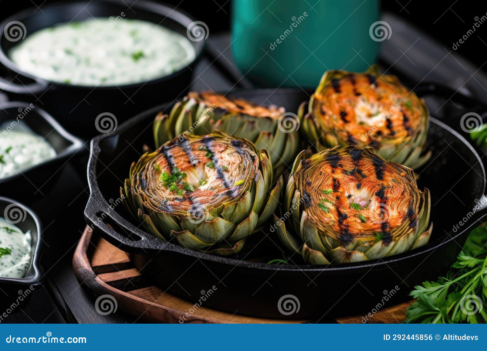 Grilled Artichokes with Dip Inside a Cast Iron Pan Stock Photo Image