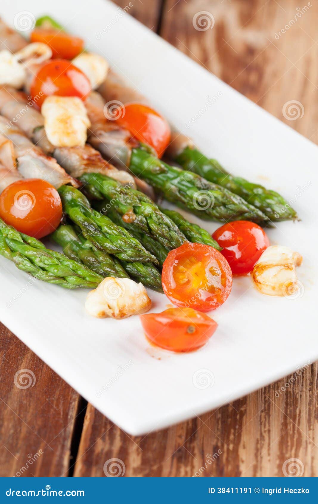 Grilled Asparagus with Prosciutto, Mozzarella and Cherry Tomatoes Stock