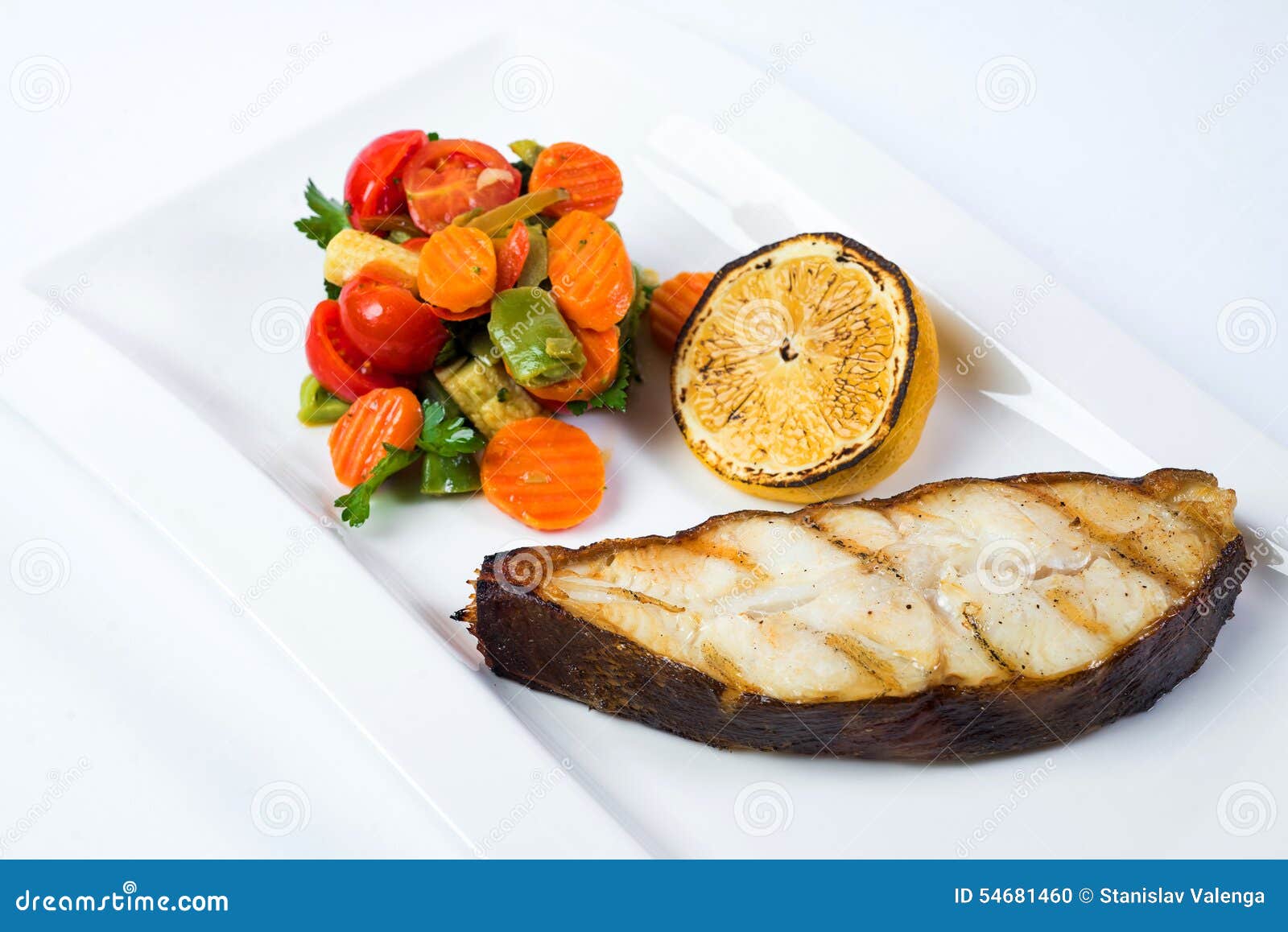 Grilled Barramundi Steak with Lemon and Vegetables Stock Photo Image