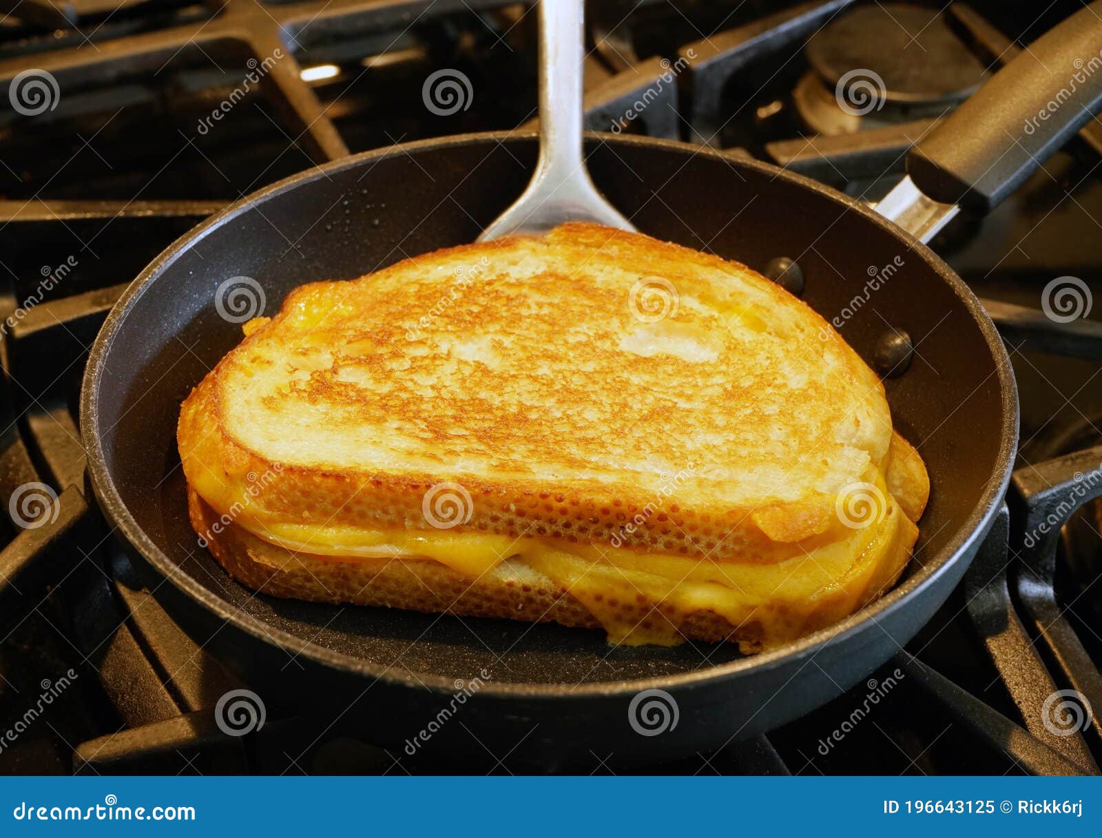 Grilled Cheese Sandwich Being Grilled in Frying Pan. Stock Image
