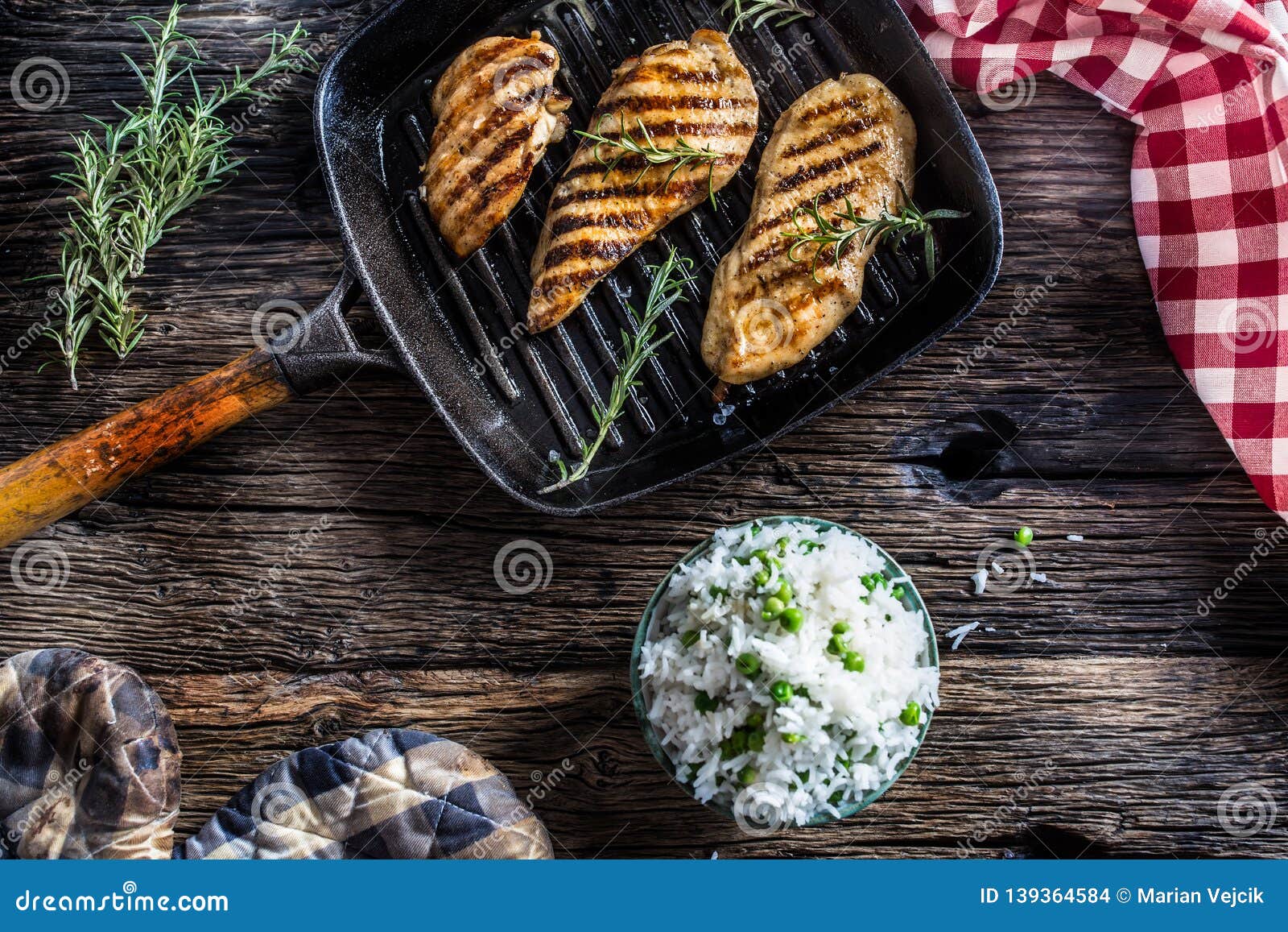 Grilled Chicken Breast on Grilled Pan with Rice and Green Peas Stock