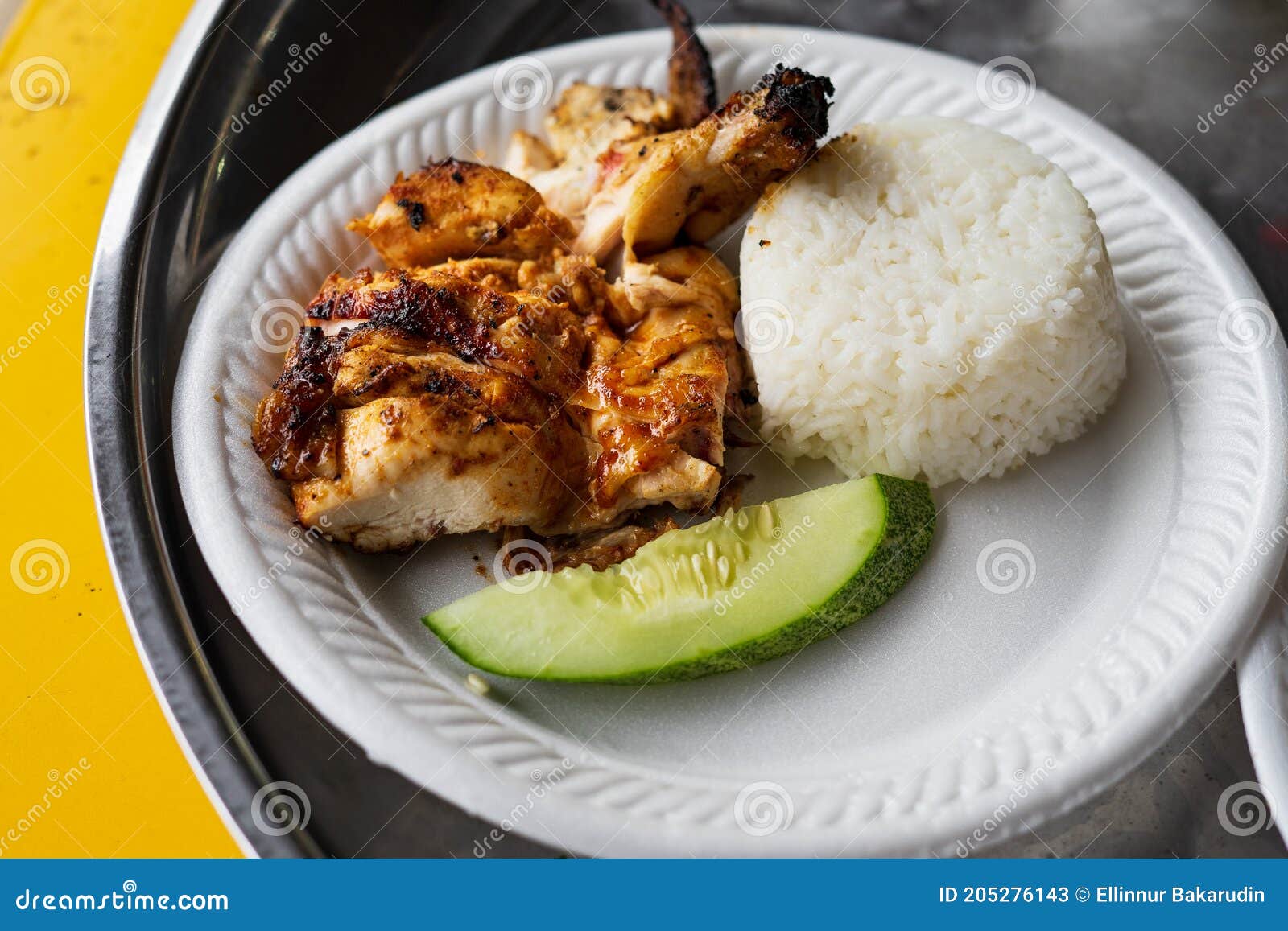 Grilled Chicken Served with Plain White Rice and Cucumber on a