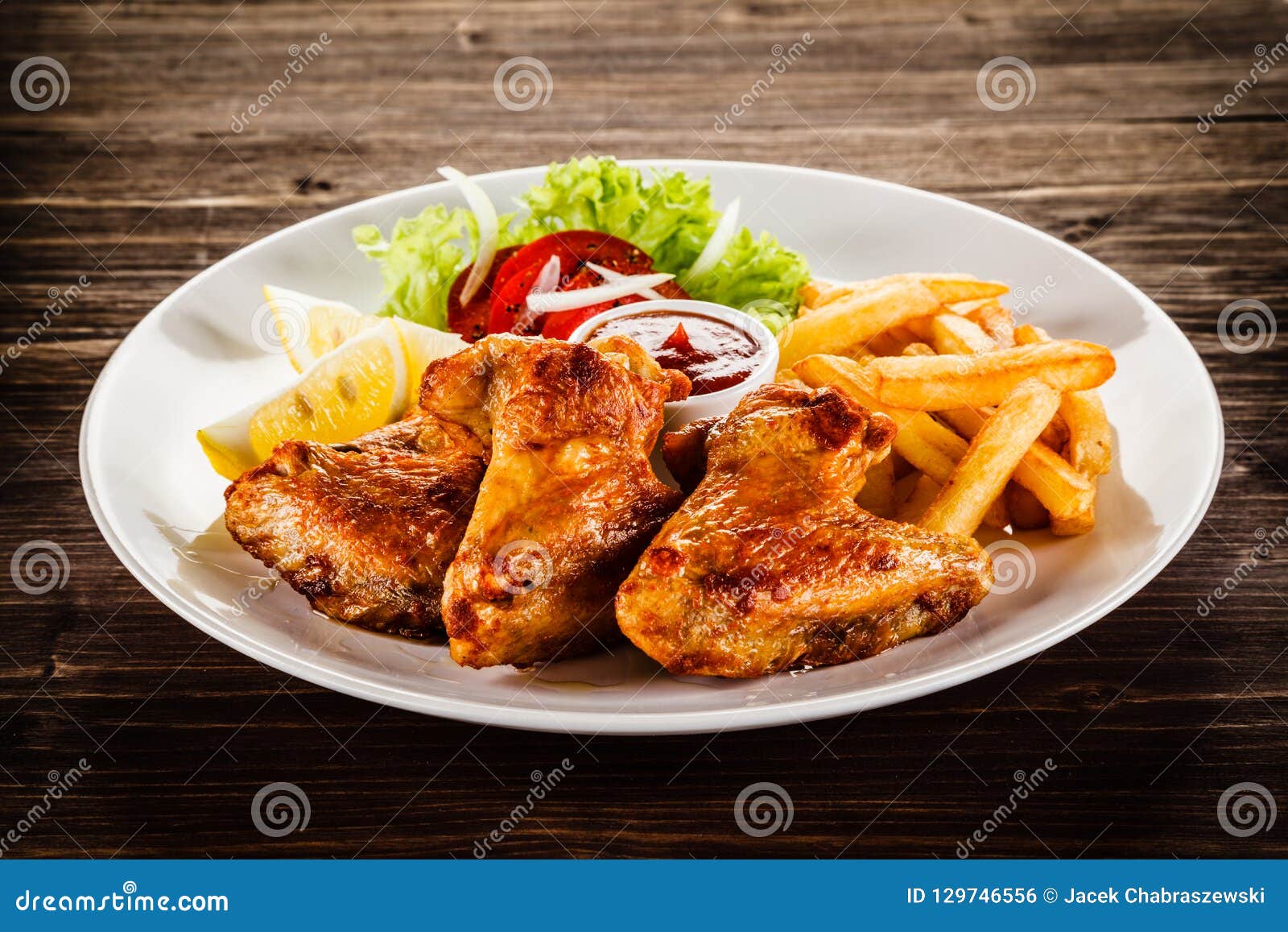 Grilled Chicken Wings, Chips and Vegetables Stock Photo - Image of ...
