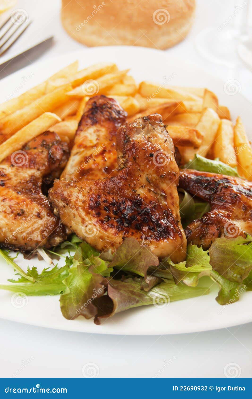 Grilled Chicken Wings with French Fries Stock Photo - Image of lettuce ...