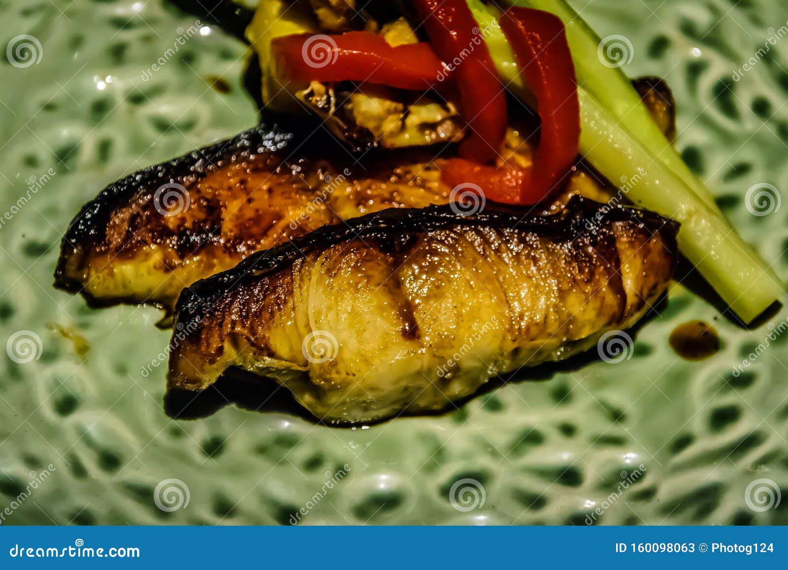 Grilled Cod Fish with a Wedge of Lemon and Soy Sauce on the Side Stock