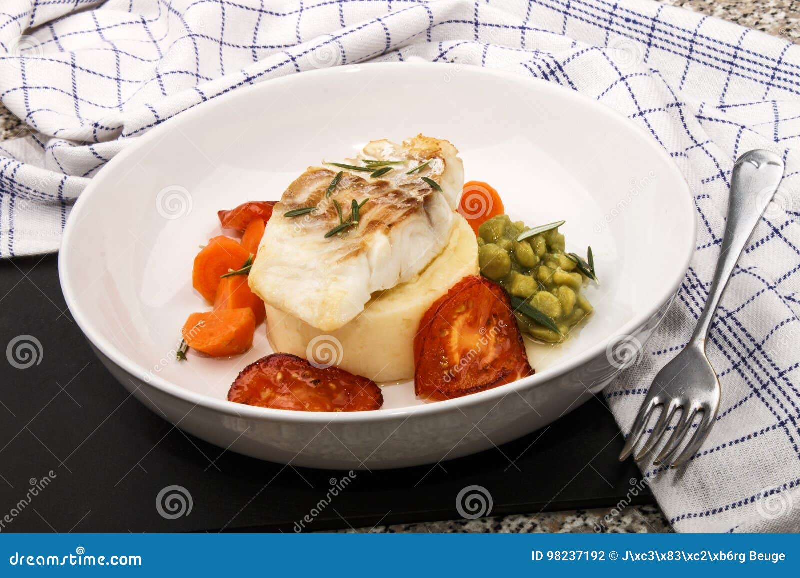 Grilled Cod with Mashed Potato, Carrots, Tomato and Mushy Pea Stock