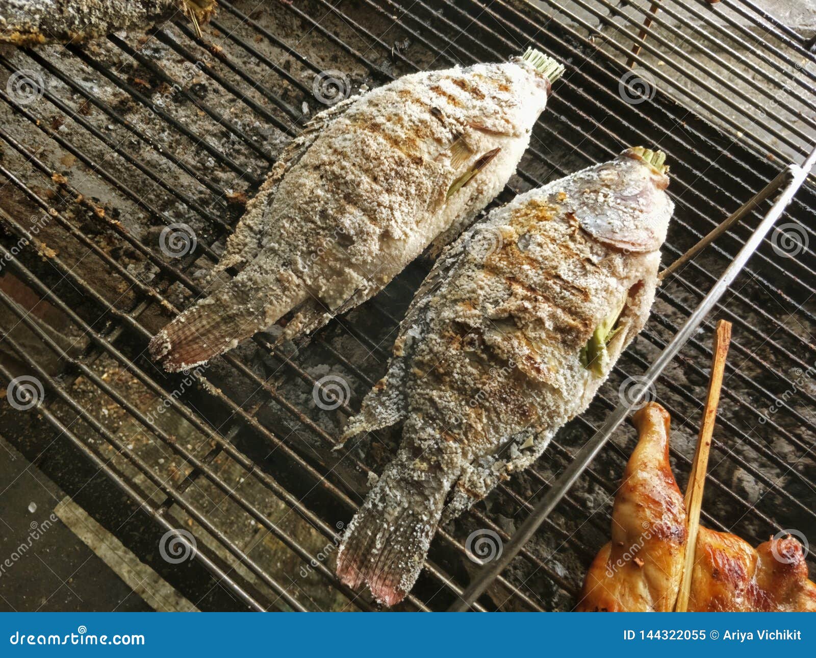 Grilled Fish on a Charcoal Grill in the Market Place Stock Image