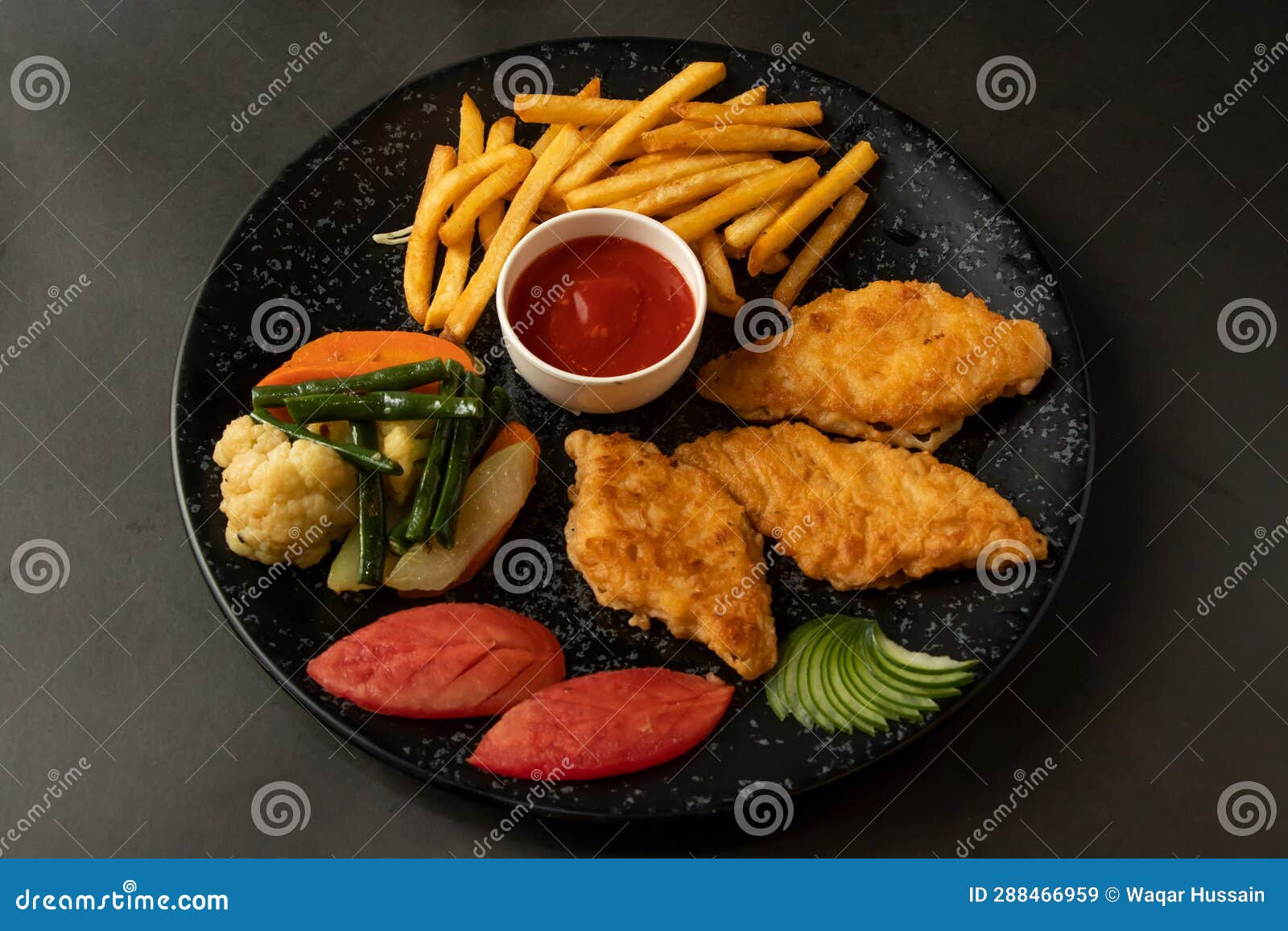 grilled fish and chips, fries, ketchup and swatted vegetables served in dish  on background top view of bangladesh and