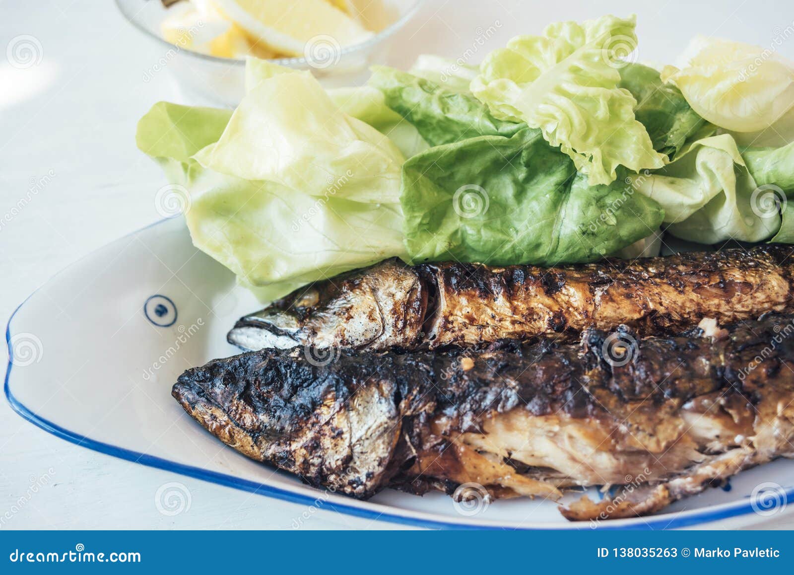Grilled fish on the plate stock image. Image of seafood 138035263