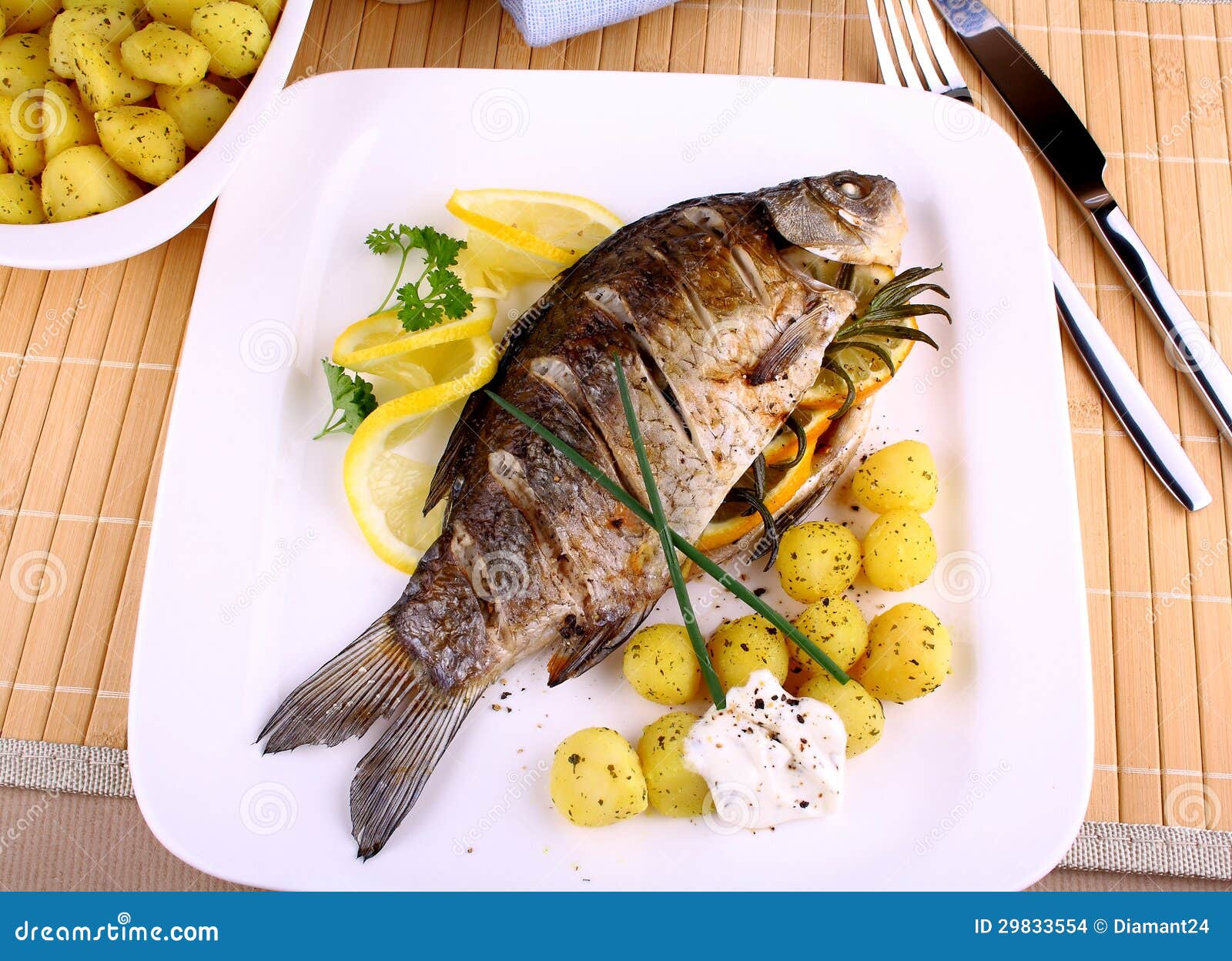 Grilled Fish with Potatoes, Sauce and Lemon Stock Photo Image of