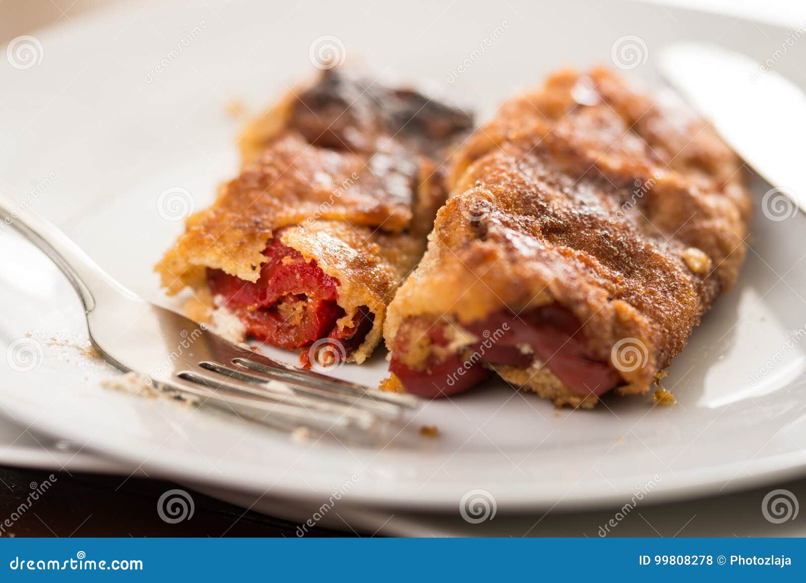 Grilled and Fried in Eggs Paprika with Knife and Fork on the Plate