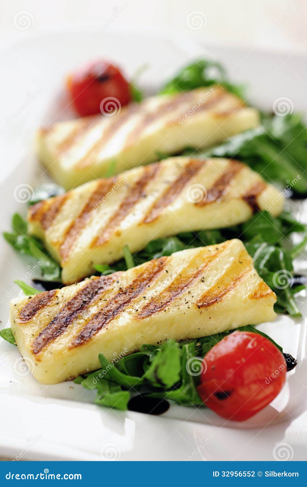 Grilled Halloumi cheese on rocket salad, selective focus